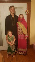 American host family in traditional Pakistani clothes