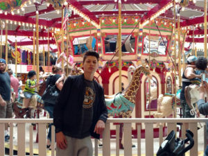 Jakob, an exchange student from Germany, at a carousel