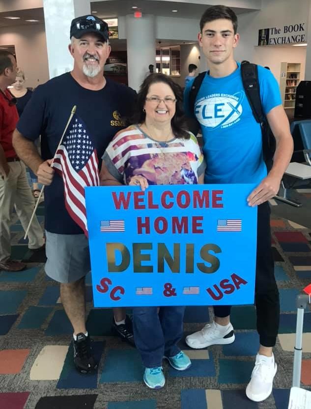 FLEX/AYA exchange student Denis from Moldova with his host family at the airport in South Carolina