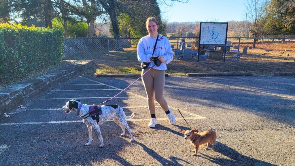 AYA exchange student from Germany walking two dogs in host city in Oklahoma