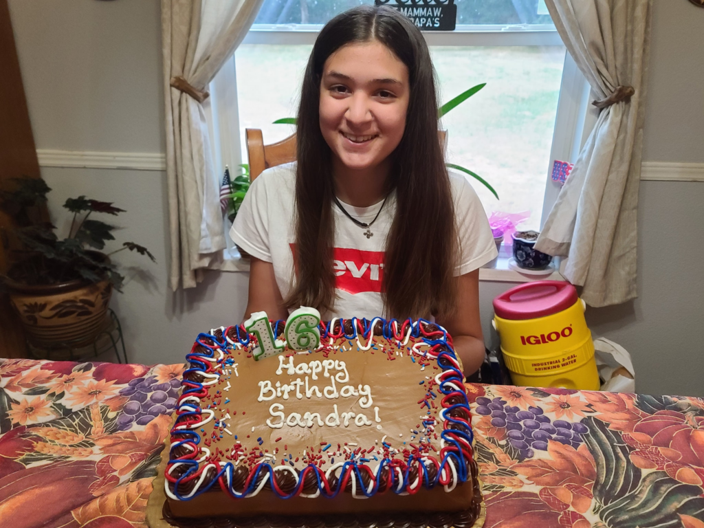 aya exchange student sandra from spain with cake on her 16th birthday