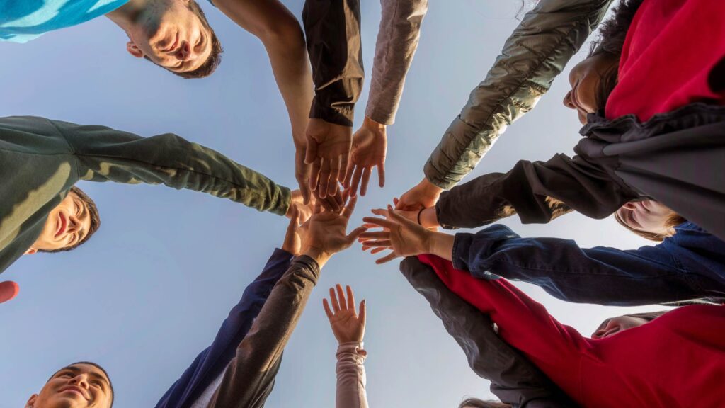 youth put hands in