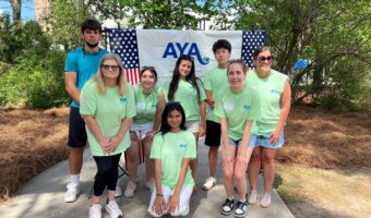 volunteering at the International Festival for the 250 Give Back Campaign